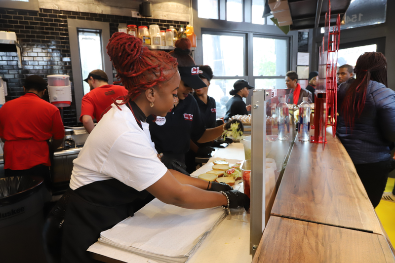 Pinky Cole works the line with the staff at Slutty Vegan.